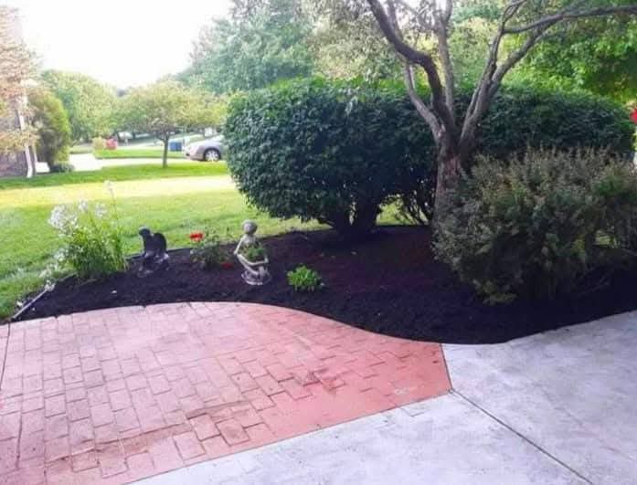 A fresh mulch bed beside a patio