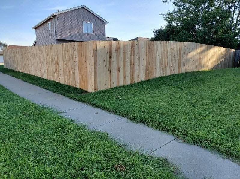 A newly built wood privacy fence